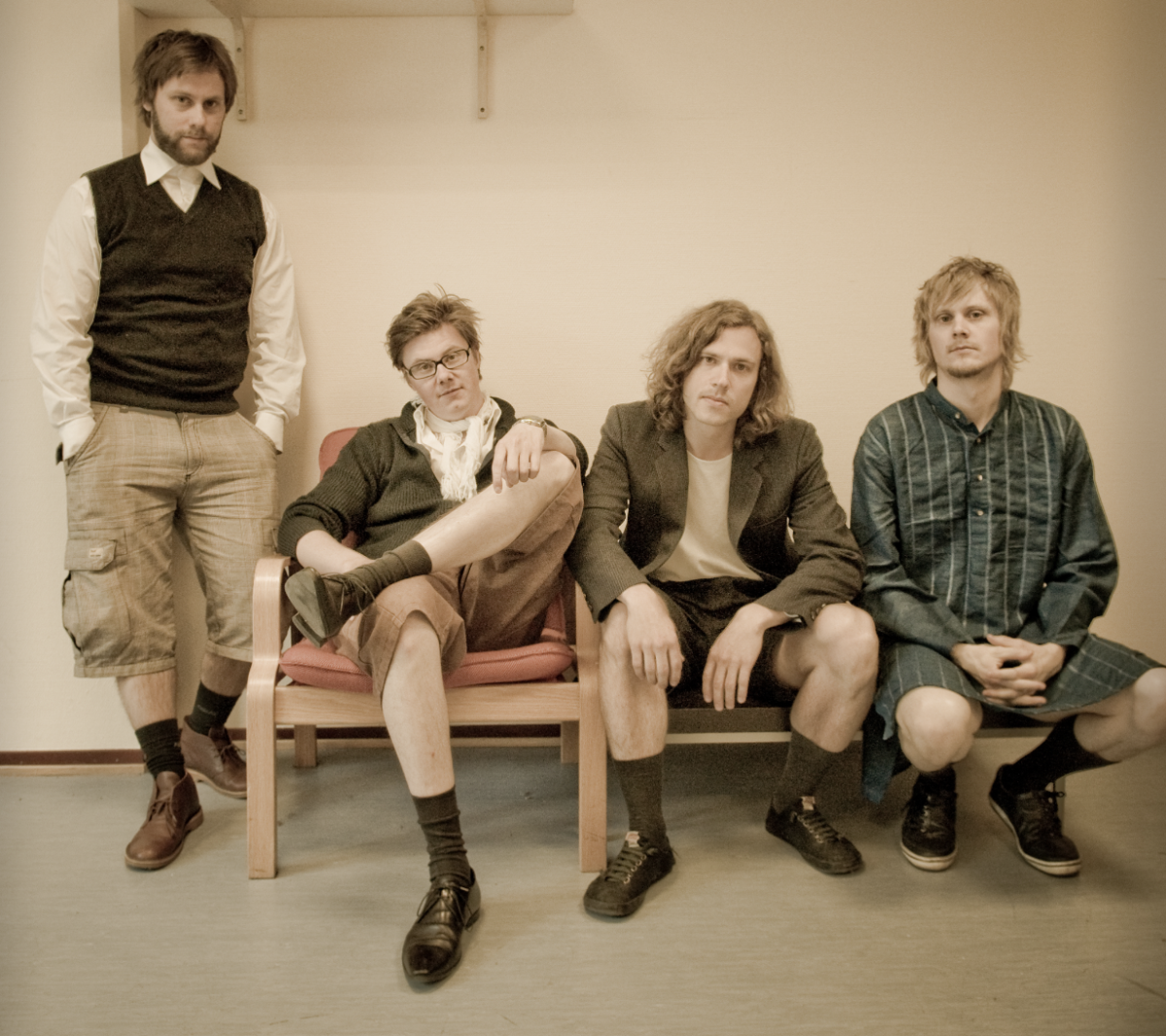 The band, shot from the front. Four young men looking into the camera